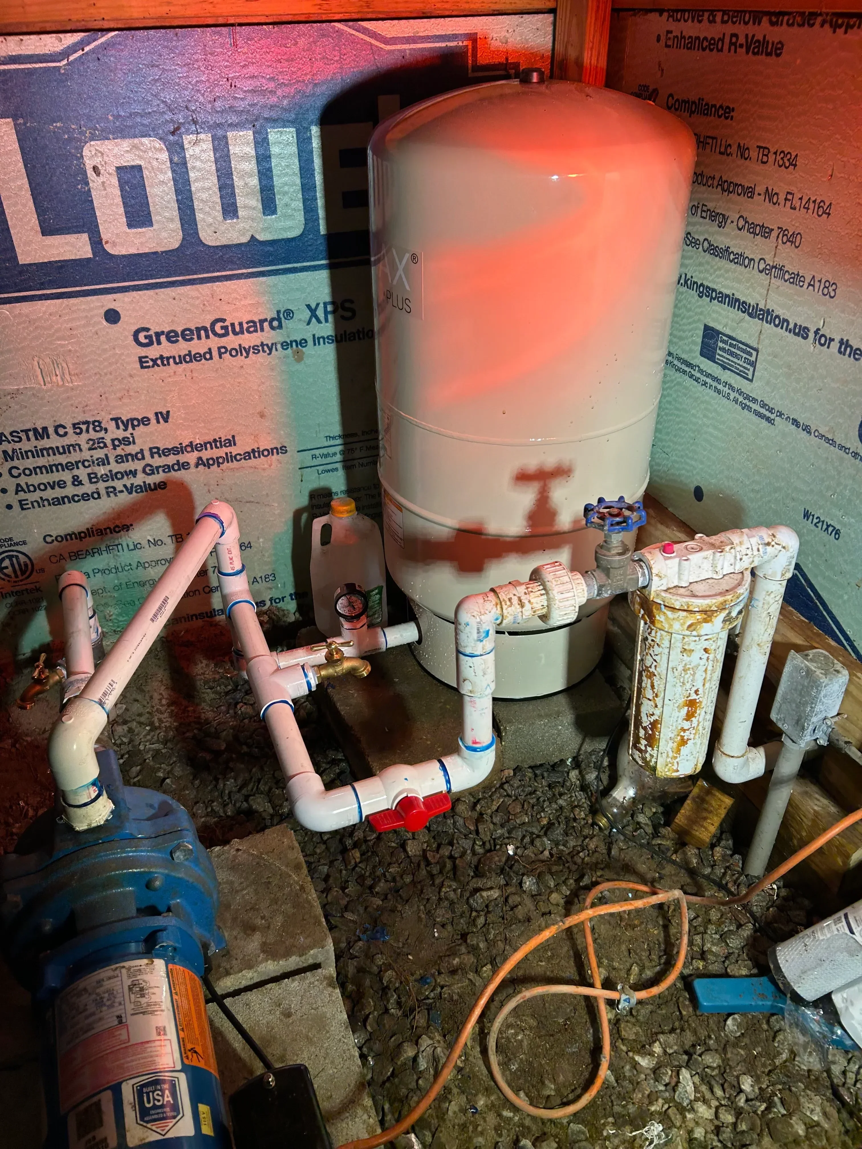 Water heater tank with copper and PVC piping, shut-off valves, and connections installed