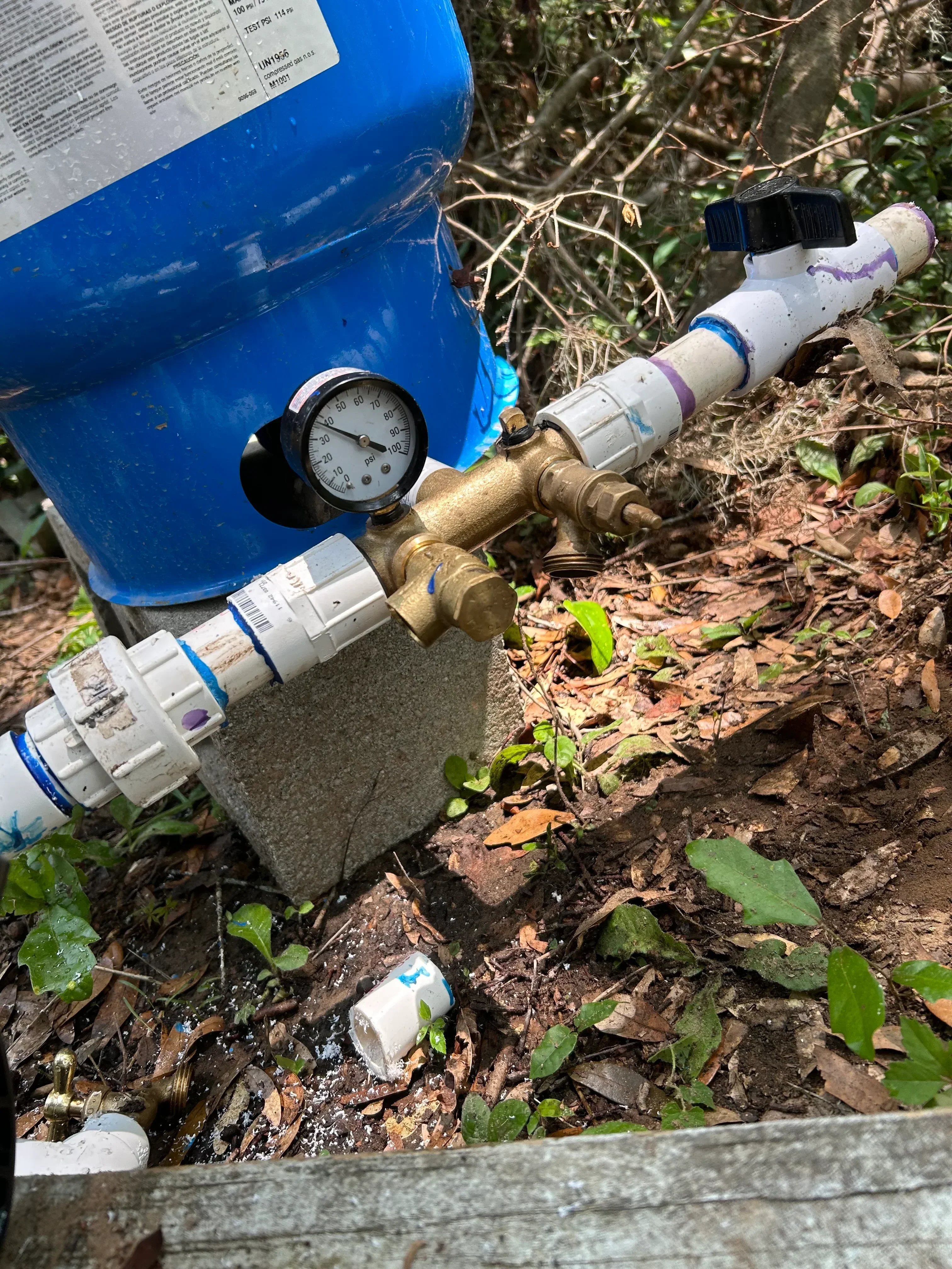 Brass water meter assembly with pressure gauge and ball valves installed on main water line