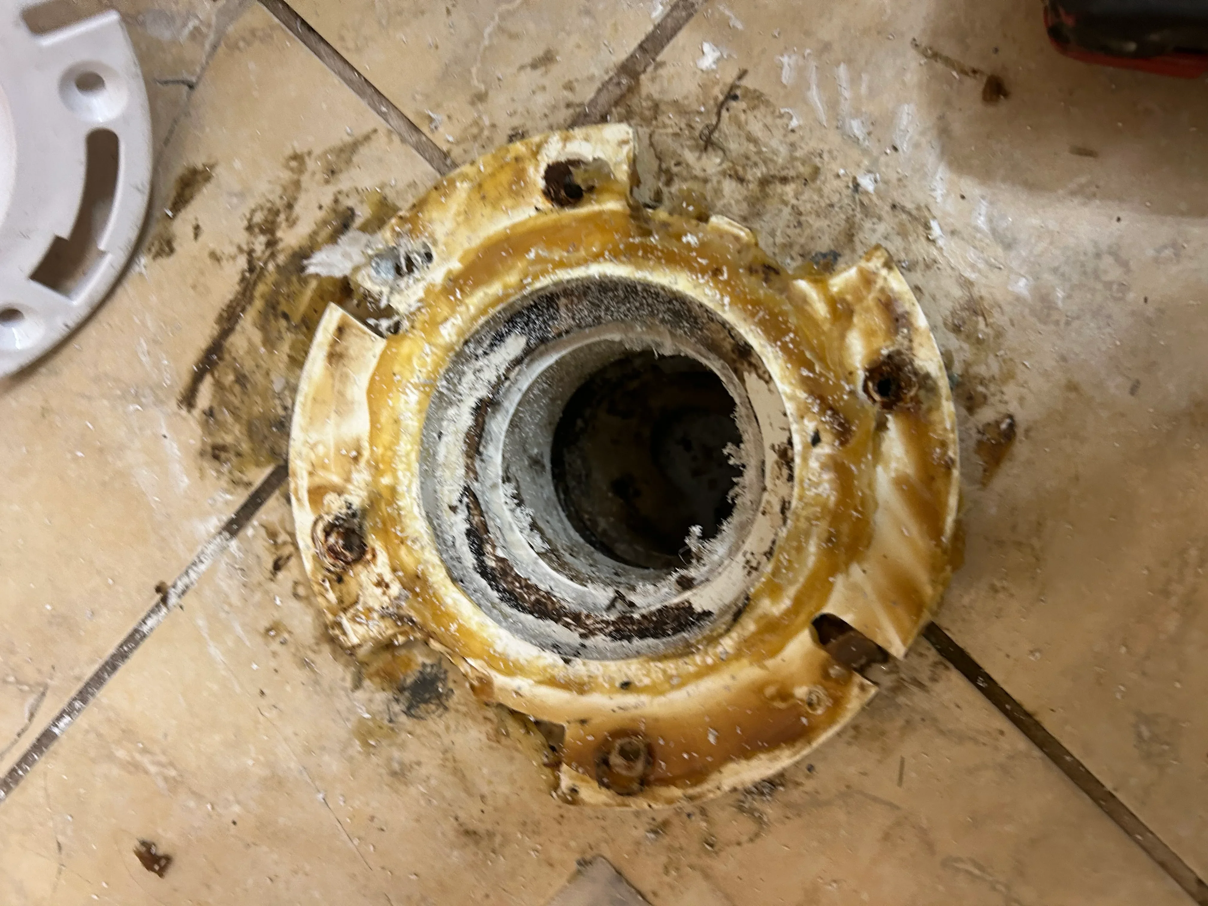 Brass plumbing fitting with drywall compound during rough-in installation